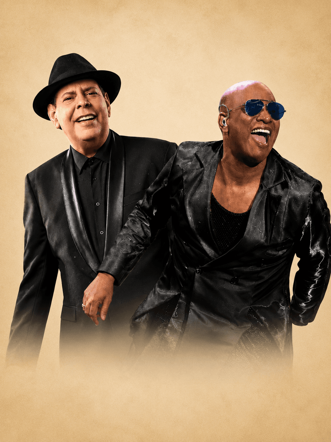 Fernando Villalona, con sombrero negro, junto a Willy García, con gafas oscuras