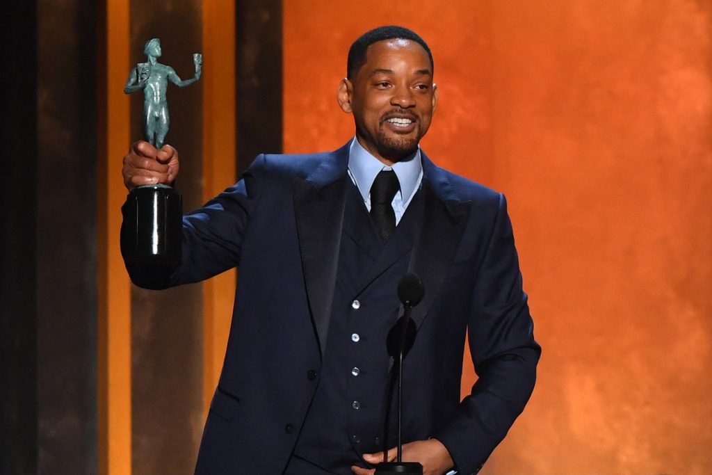 US actor Will Smith accepts the award for Outstanding Performance by a Male Actor in a Leading Role for King Richard onstage during the 28th Annual Screen Actors Guild (SAG) Awards at the Barker Hangar in Santa Monica, California, on February 27, 2022. (Photo by Patrick T. FALLON / AFP) (Photo by PATRICK T. FALLON/AFP via Getty Images)