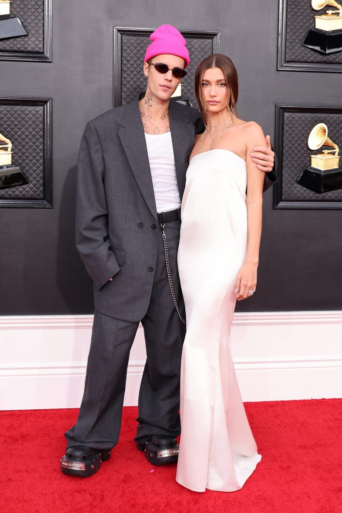 LAS VEGAS, NEVADA - APRIL 03: (L-R) Justin Bieber and Hailey Bieber attend the 64th Annual GRAMMY Awards at MGM Grand Garden Arena on April 03, 2022 in Las Vegas, Nevada. (Photo by Amy Sussman/Getty Images)
